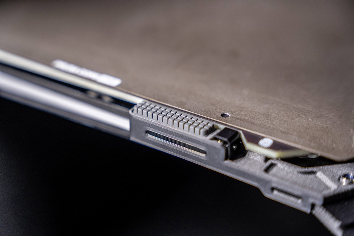 The nozzle wiper mounted at the front edge of the heatbed, a standard consumable part owners are meant to replace themselves (Prusa Research)